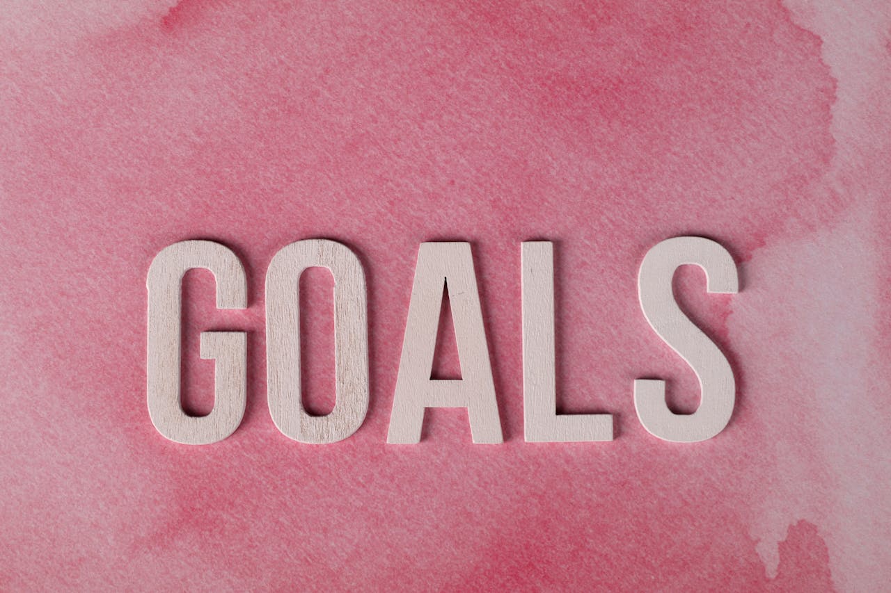 inspiring-pink-goals-text-on-watercolor-background-32240622